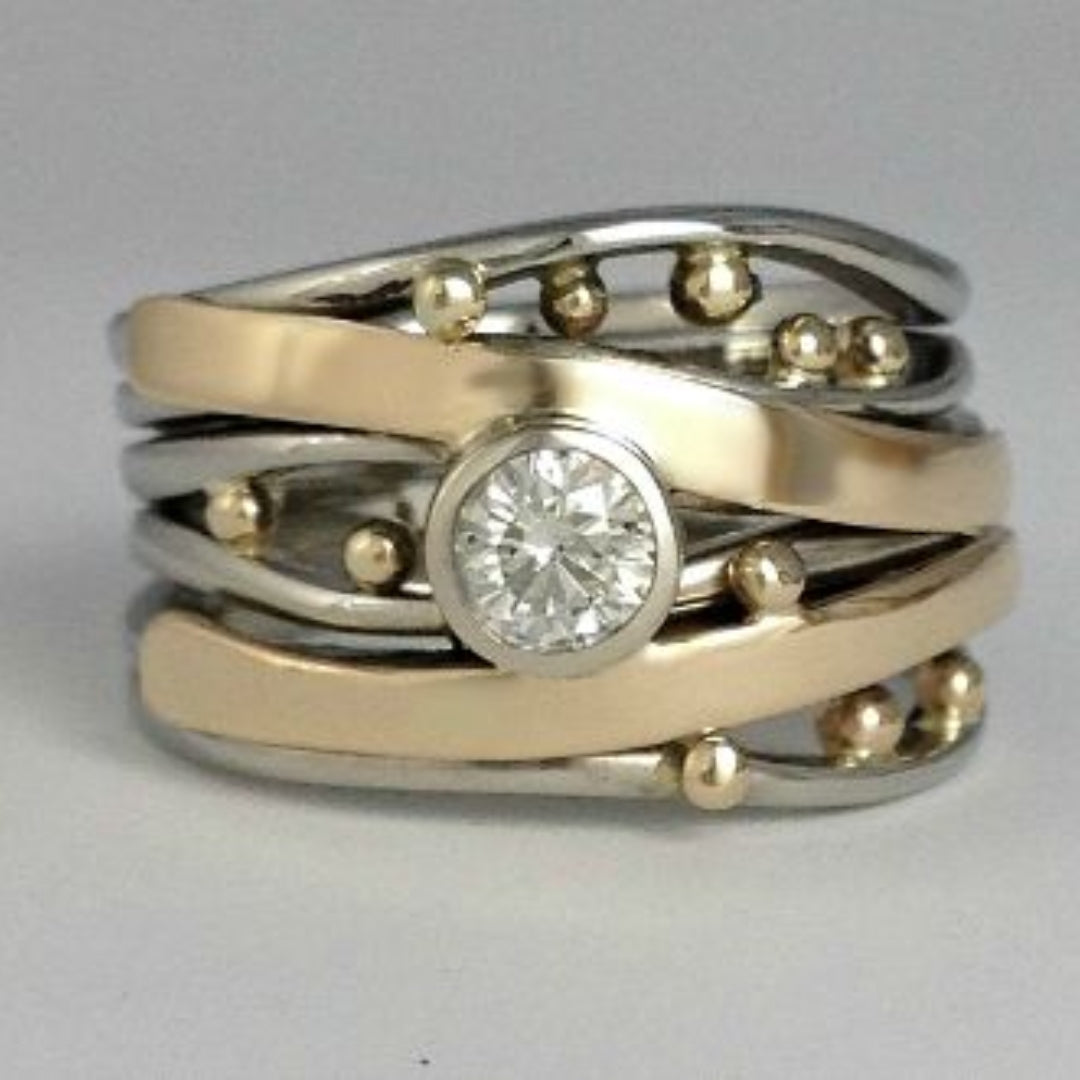 Two-tone sterling silver and gold-plated ring with bezel setting