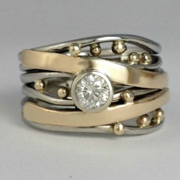 Two-tone sterling silver and gold-plated ring with bezel setting