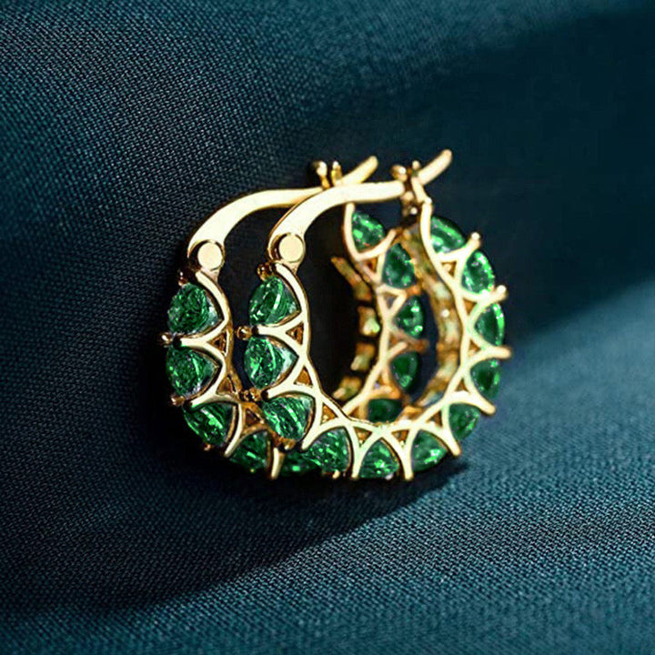Gold checkered hoop earrings with emeralds