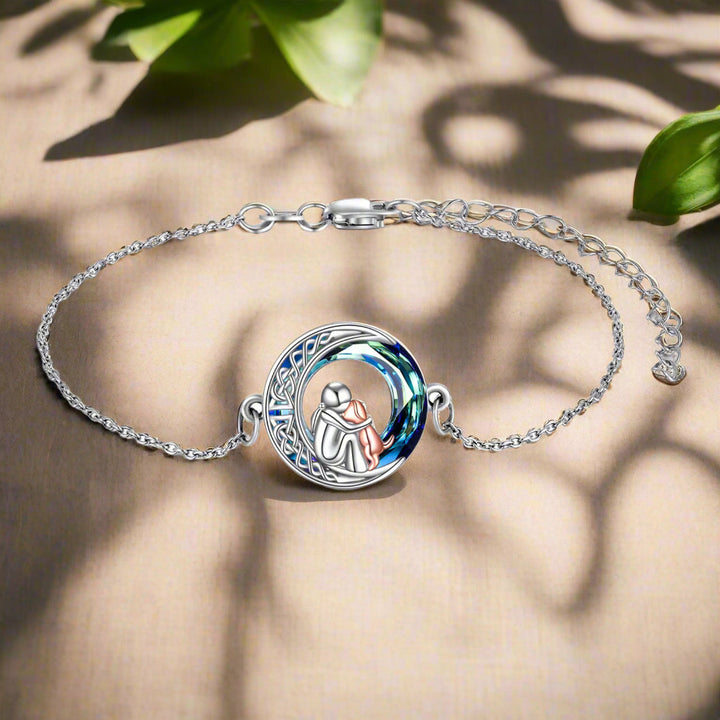 Adjustable sterling silver bracelet with a dog charm