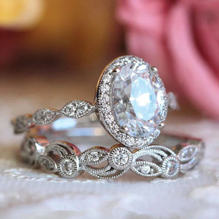 Set of silver-plated rings with rounded white glass