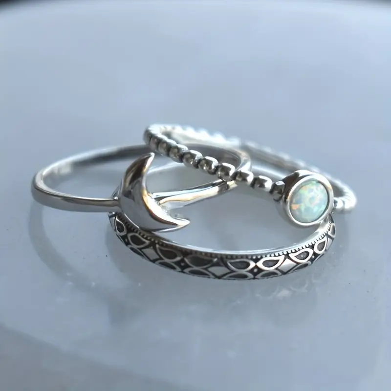 Set of opal and moon motif rings